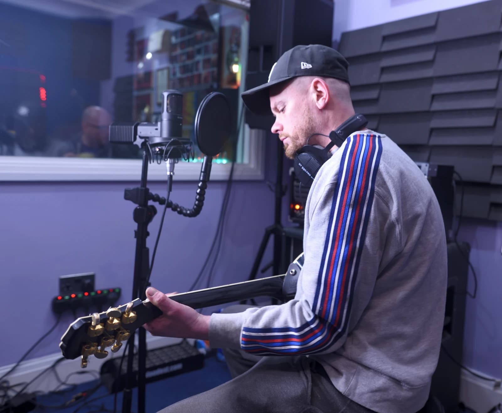 Live room at Moorcroft Studios with an artist tracking guitar